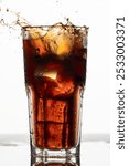 rum with cola and ice, A splash into a glass of cola, a refreshing summer drink, cola with ice, frozen motion, macro