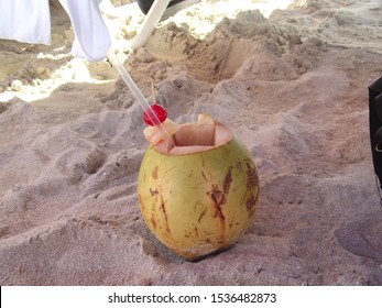 Rum Punch In A Coconut On A Beach In The Caribbean