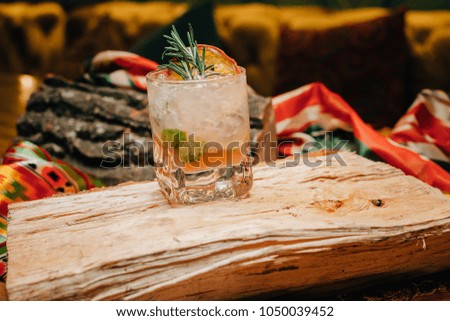 Rum-based cocktail with ice and lime