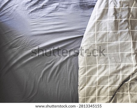 rumpled bed after waking up
