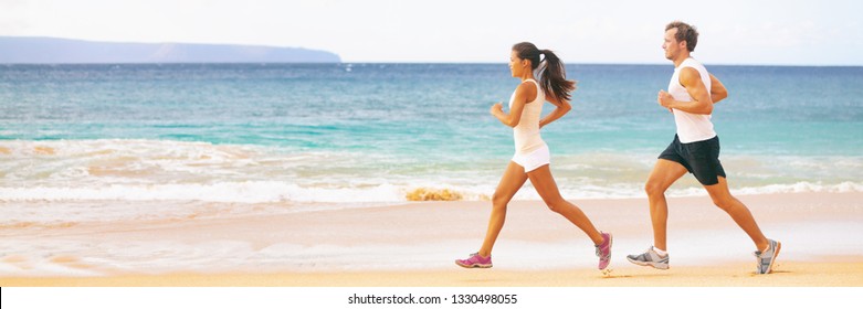 Run Fit Couple Running Together On Beach Banner Panoramic Background. Two Fitness Athlete Jogging - Summer Active Lifestyle.