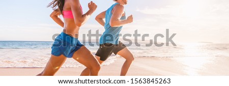 Run fit people running on beach with healthy toned legs body, Hamstring muscles, knee joint health active lifestyle panoramic banner background.