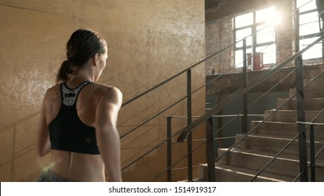 Run. Runner Woman Running Up Stairs, Training Indoors. Athletic Girl With Fit Body In Sport Clothes Running Upstairs, Exercising 