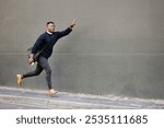 Run, rush and businessman by wall in city calling for cab, taxi or public transport for work commute. Late, travel and African male finance advisor with lift, bus or metro in town with mockup space