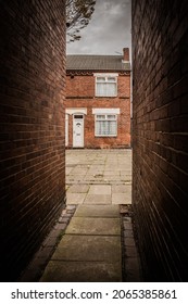 A rundown terraced house and back alleys in the North of England, UK