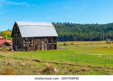 A Rundown Vintage Rustic Barn With Metal Roof In The Rural Mountain Town Of Athol, In The Coeur D'Alene, Idaho Area Of Northwest, USA