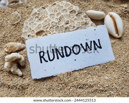 Rundown writting on beach sand background.