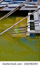 Rung Of Wooden Ladder Under Water