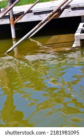 Rung Of Wooden Ladder Under Water