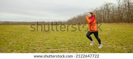 Runner caucasian woman jogging in autumn park. Healthy lifestyle concept. Active sports people