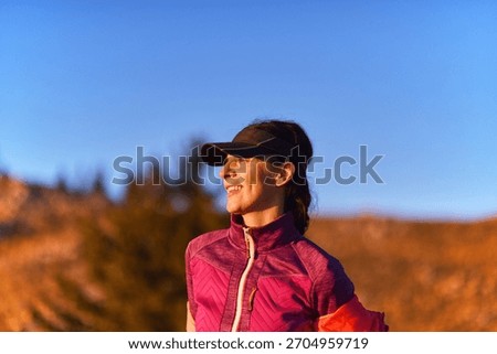 Runner enjoys sunset while exercising in a scenic mountain landscape