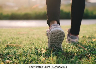Runner feet running on running road close up on shoe. women fitness - Shutterstock ID 1095092414