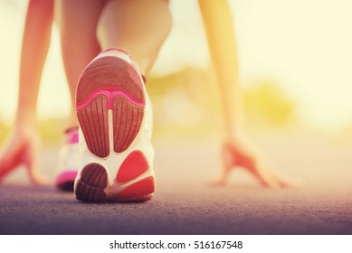 Runner Feet Running On Road Closeup On Shoe. 

