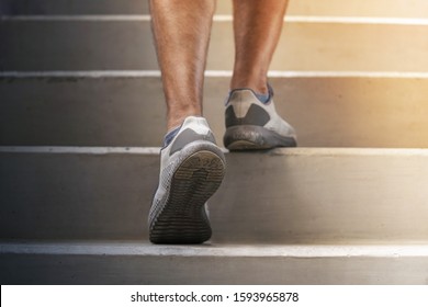 Runner Feet Running On Stairs Close Up On Shoe