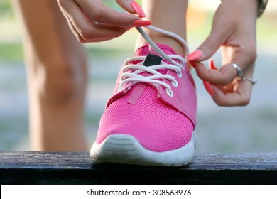 Runner Girl  Tying Pink Shoes