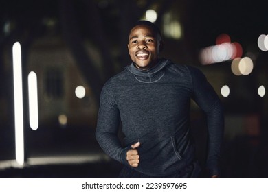 Runner, health or fitness black man at night running in city, street or road for marathon training, race event or workout. Happy, smile or sports athlete for wellness exercise, goal target or success - Powered by Shutterstock