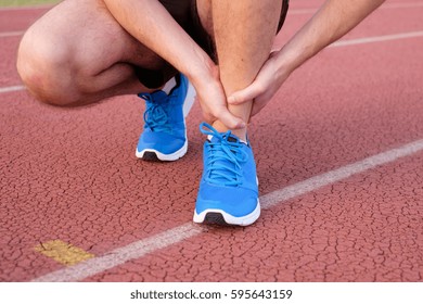 Runner With Injured Ankle On The Track