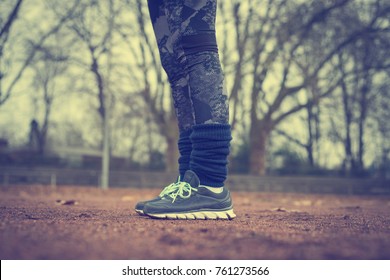 Runner legs on red running track at stadium or sports field. - Shutterstock ID 761273566