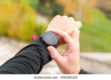 Runner Man Checking Stopwatch. Hands Detail. Unrecognizable.