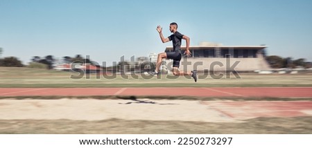 Runner, man jump and sports stadium for marathon training, fitness workout or wellness exercise on track. Athlete, speed and running energy or jumping for olympics high jump performanc and challenge