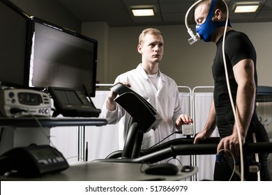 Runner With A Mask On A Treadmill In The Doctor's Office