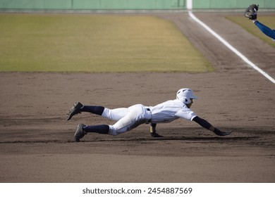 A runner returning to base after a pickoff attempt (high school baseball)