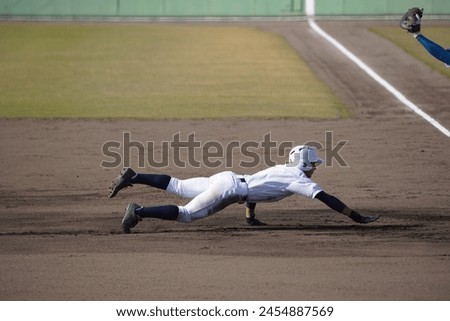 A runner returning to base after a pickoff attempt (high school baseball)