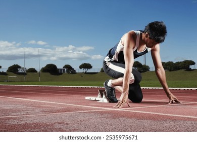 Runner, start and man with exercise, training and ready with energy, challenge and routine. Person, athlete and healthy guy on track, sports and workout with wellness, goals and marathon with fitness