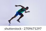 Runner stepping into low start posture before sprint. Concept of athlete preparation tutorials, sprint mechanics lessons, sports education materials, and fitness training resources.