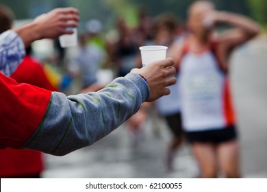 Runner Take A Water In A Marathon Race