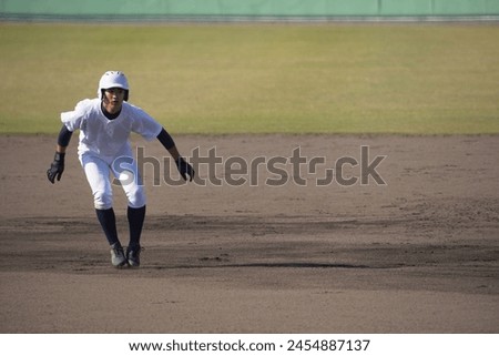 A runner taking a big lead (high school baseball)