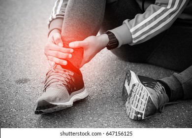 Runner Touching Painful Twisted Or Broken Ankle. Athlete Runner Training Accident. Sport Running Ankle Sprained Sprain Cause Injury.