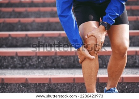 Runner touching painful twisted or broken. Athlete training, running up and down stairs accident. 