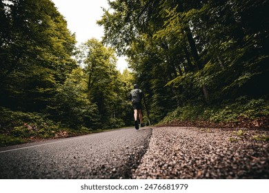 Runner training in the country on asphalt road - Powered by Shutterstock