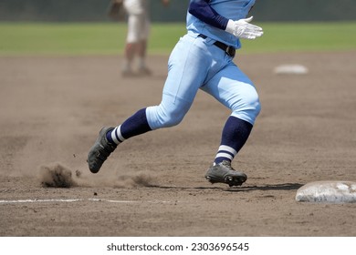 Runner trying to get to the next base during a baseball game