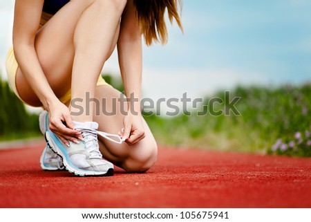 Runner trying running shoes getting ready for jogging