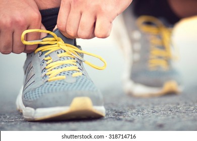 Runner Tying Shoelaces On Sneakers