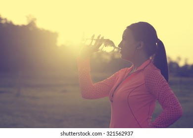 Runner Woman Drinking Water