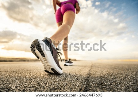 Runner woman feet running on urban road - Fit female athlete workout on city street - Wellness and sport life style concept