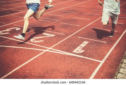 Runners Approaching The Finish Line Of A Race