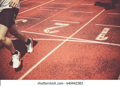 Runners Approaching The Finish Line Of A Race