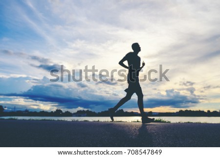 Runner's Feet, Motion Blurred runner closeup shot  runner running at a fast pace background clouds sky sunlight
