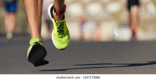 Runners Feet Running On Road Close Up On Shoe, Male Triathlete Runner