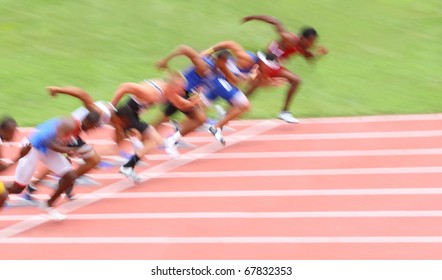 Runners leaving the starting line (Motion blur) - Powered by Shutterstock