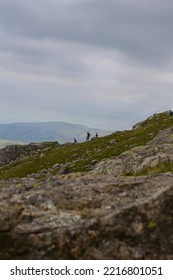 Runners On The Ridge Line In The Lakes