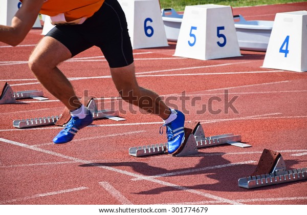 Runners on the running\
track