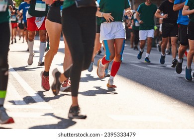 Runners on the street. Healthy lifestyle. Motion exercise. Athletics - Shutterstock ID 2395333479