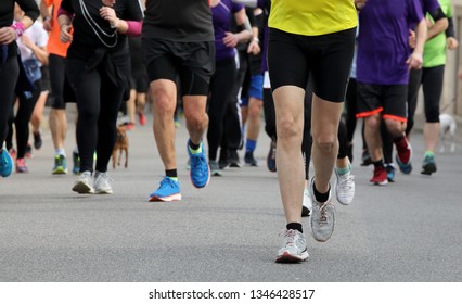 Runners Run At Footrace In The City In Spring