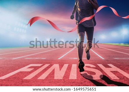 Runners running towards the finish line. Success concept.