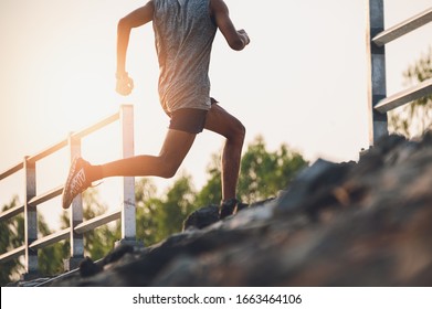 Runners running upstairs.Young sport man running for exercise.Sports and healthy lifestyle fitness, sport,exercising concept. - Powered by Shutterstock